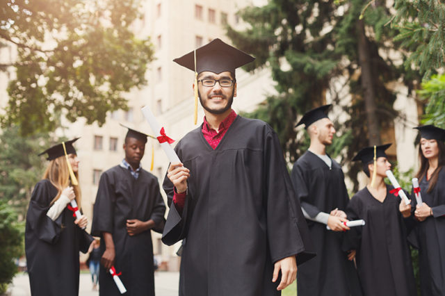 Happy young man on his graduation day. Man on graduation day
